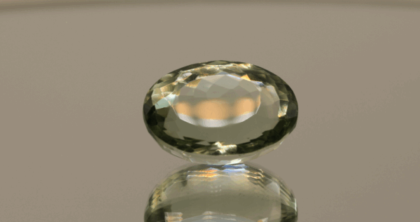 Natural prasiolite gemstone, 14.51 carat, oval cut, pale green color, untreated, loose gemstone, dimensions 18 × 12.7 × 9.8 mm, ideal for fine jewelry.