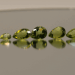 Natural peridot set, total weight 11.56 carat (12 stones), pear cut, yellowish green color, untreated, loose gemstones, dimensions 5.8–9.2 × 3.8–6.6 × 2.7–4.7 mm, ideal for fine jewelry.