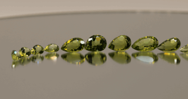Natural peridot set, total weight 11.56 carat (12 stones), pear cut, yellowish green color, untreated, loose gemstones, dimensions 5.8–9.2 × 3.8–6.6 × 2.7–4.7 mm, ideal for fine jewelry.