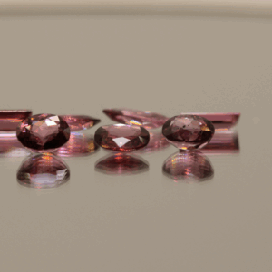 Natural rhodolite garnet gemstones 5.1 carats mixed cuts light purple color untreated loose stones set
