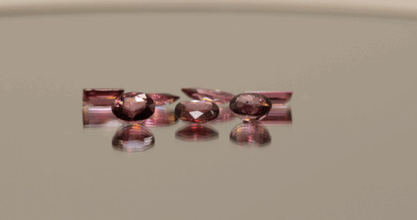 Natural rhodolite garnet gemstones 5.1 carats mixed cuts light purple color untreated loose stones set