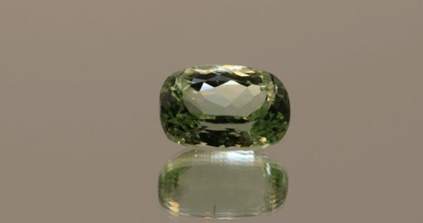Light green cushion-shaped spodumene, 9.15 carat, 14.3 × 10 × 7.5 mm, no treatment, unknown origin.