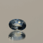 Blue sapphire gemstone 1.01 carat oval cut, heat-treated, Madagascar origin, dimensions 6.98 × 5.07 × 3.26 mm, GFCO certified.