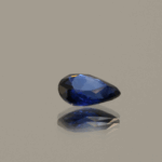 Royal blue pear-shaped sapphire, 0.70 carat, 6.81 × 4.98 × 2.44 mm, heat-treated, Madagascar origin, IGS certified.