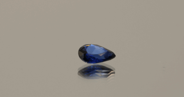 Royal blue pear-shaped sapphire, 0.70 carat, 6.81 × 4.98 × 2.44 mm, heat-treated, Madagascar origin, IGS certified.