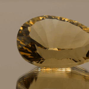 Brownish yellow pear-shaped smoky quartz, 26.46 carat, 26.3 × 16.6 × 12.0 mm, no treatment, unknown origin.