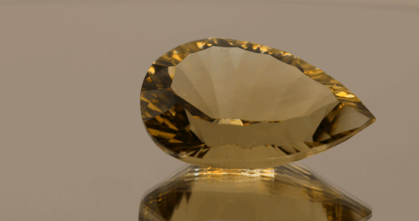 Brownish yellow pear-shaped smoky quartz, 26.46 carat, 26.3 × 16.6 × 12.0 mm, no treatment, unknown origin.