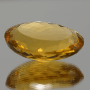 Natural oval cut citrine gemstone with yellow-orange color, 23.10 × 16.30 mm