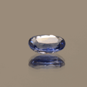 Natural sapphire gemstone, 0.89 carat, oval cut, cornflower blue color, heat-treated, loose gemstone, dimensions 6.87 × 4.92 × 2.67 mm, origin Sri Lanka, GFCO certified.