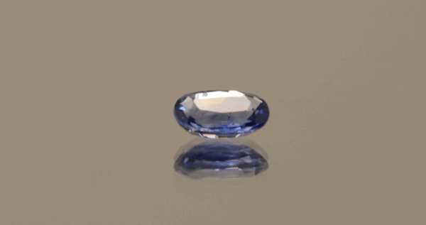 Natural sapphire gemstone, 0.89 carat, oval cut, cornflower blue color, heat-treated, loose gemstone, dimensions 6.87 × 4.92 × 2.67 mm, origin Sri Lanka, GFCO certified.