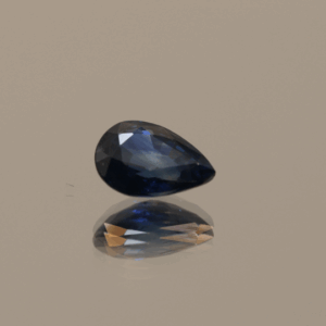 Royal blue pear-shaped sapphire, 0.8 carat, 6.79 × 4.97 × 2.98 mm, heat-treated, Madagascar origin, IGS certified.