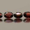 Set of 4 natural almandine garnets, 5.65 carats total, oval cut, purple-red color, untreated