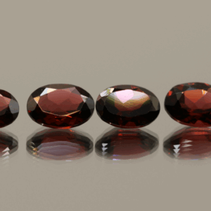 Set of 4 natural almandine garnets, 5.65 carats total, oval cut, purple-red color, untreated