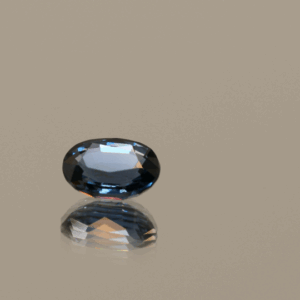 Oval-shaped Intense blue spinel gem, 1.08 carat, 7.02 × 5.45 × 3.24 mm, color change, no treatment, unknown origin, ALGT certified.