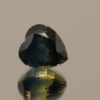 Natural Blue Sapphire Heart gemstone, 3.7 carat, heart cut, greenish-blue color, heat treated, loose gemstone, dimensions 8.47 × 7.86 × 6.92 mm, origin Madagascar, AIG certified.