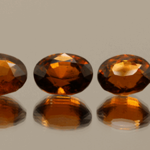 Set of 4 natural hessonite garnets, 12.31 carats total, oval cut, orange color, untreated