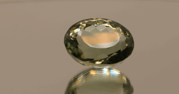 Natural prasiolite gemstone, 19.64 carat, oval cut, pale green color, untreated, loose gemstone, dimensions 19 × 14.6 × 11.4 mm, ideal for fine jewelry.