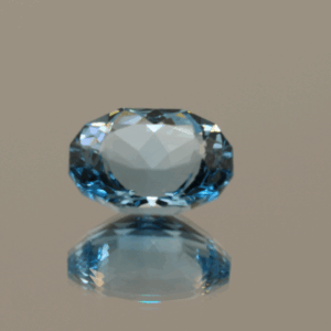 Blue oval-shaped topaz, 5.75 carat, 12.32 × 9.43 × 6.49 mm, no treatment, unknown origin.