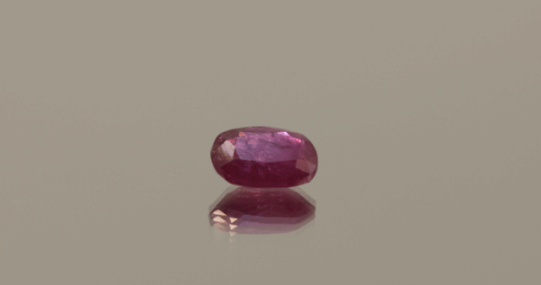 Natural ruby red oval gemstone, 1.72 carat, oval cut, red color, unheated, loose gemstone, dimensions 8.25 × 6.21 × 3.47 mm, origin unknown, AIG certified.