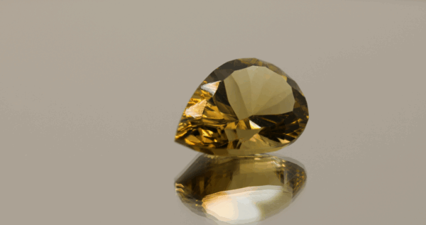 Brownish yellow pear-shaped smoky quartz, 8.52 carat, 17.6 × 11.8 × 8.20 mm, no treatment, unknown origin.