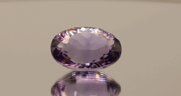 Natural oval cut amethyst gemstone with purple violet color, 19.30 × 15.00 mm