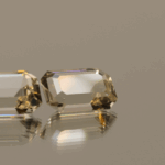 Pair of faceted Topaz gemstones, colorless, octagon cut, 7.7 carats total, high clarity, ideal for fine jewelry.