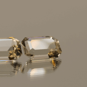 Pair of faceted Topaz gemstones, colorless, octagon cut, 7.7 carats total, high clarity, ideal for fine jewelry.