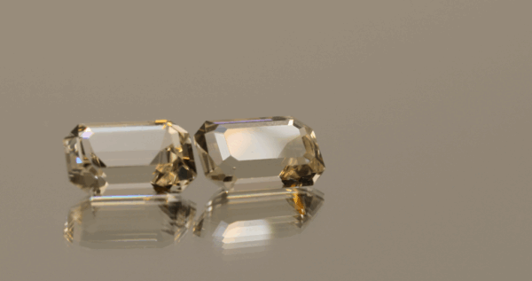 Pair of faceted Topaz gemstones, colorless, octagon cut, 7.7 carats total, high clarity, ideal for fine jewelry.