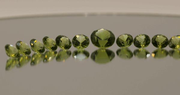 Natural peridot set totaling 21 carat, round cut, yellow green color, untreated, loose gemstones, dimensions 9.6 × 5.1 × 4.4–6.5 mm, perfect for fine jewelry.