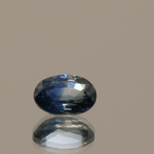 Blue sapphire gemstone 1.06 carat oval cut, heat treated, Madagascar origin, dimensions 6.99 × 5.08 × 3.29 mm, GFCO certified.