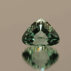Light green trillion-shaped spodumene, 7.19 carat, 13 × 10.1 × 8.3 mm, no treatment, unknown origin.