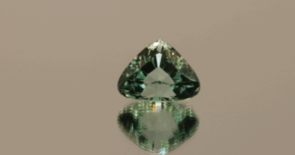 Light green trillion-shaped spodumene, 7.19 carat, 13 × 10.1 × 8.3 mm, no treatment, unknown origin.
