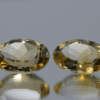 Natural oval cut citrine gemstone with yellow-orange color, 14.15 × 10.00 mm
