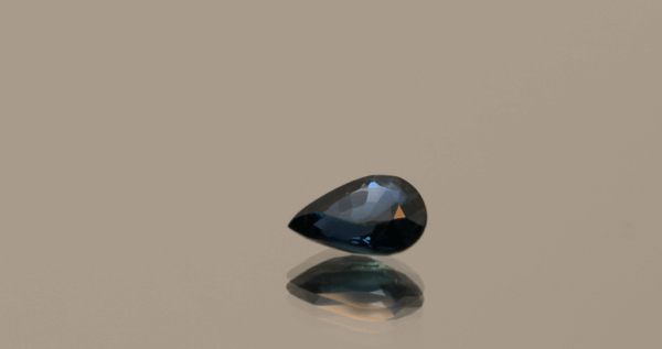 Royal blue pear-shaped sapphire, 0.73 carat, 6.87 × 4.8 × 2.92 mm, heat-treated, Madagascar origin, IGS certified.