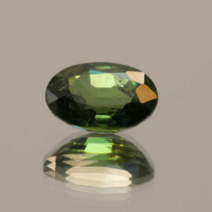 Oval vivid green sapphire 2.53 carat, heat-treated, Madagascar origin, dimensions 9.44 × 7.11 × 4.22 mm, AIG certified.