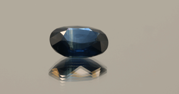 Exotic blue sapphire, oval heat treated, Madagascar origin, 3.83 carat, dimensions 11.12 × 8.32 × 4.69 mm, AIG certified.