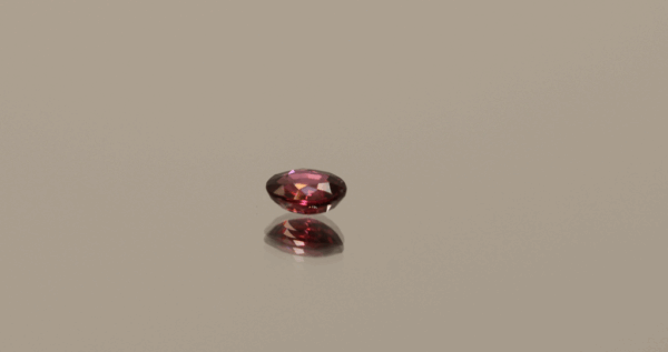 Natural ruby stone, 0.53 carat, oval cut, red color, unheated, loose gemstone, dimensions 5.28 × 4.31 × 2.31 mm, origin Mozambique, AIG certified.