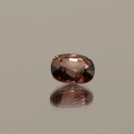 Orange pink cushion-shaped Mahenge spinel, 1.33 carat, 7.17 × 5.85 × 4.01 mm, no treatment, Tanzania origin, AIG certified.