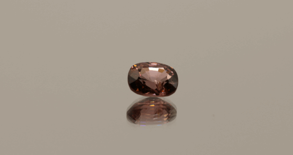 Orange pink cushion-shaped Mahenge spinel, 1.33 carat, 7.17 × 5.85 × 4.01 mm, no treatment, Tanzania origin, AIG certified.