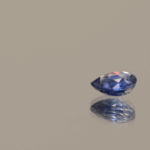 Blue pear-shaped sapphire, 0.62 carat, 5.44 × 5.18 × 2.46 mm, heat-treated, unknown origin, AIG certified.