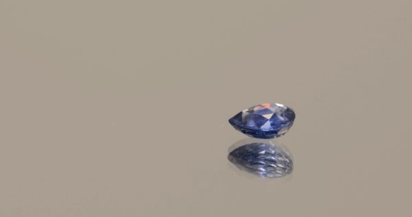 Blue pear-shaped sapphire, 0.62 carat, 5.44 × 5.18 × 2.46 mm, heat-treated, unknown origin, AIG certified.