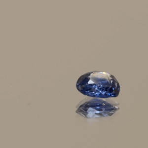 Blue pear-shaped sapphire, 0.57 carat, 5.48 × 5.33 × 2.37 mm, heat-treated, unknown origin, AIG certified.