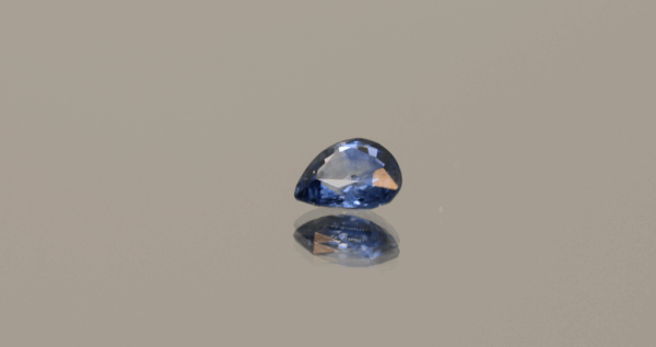 Blue pear-shaped sapphire, 0.62 carat, 5.70 × 5.31 × 2.44 mm, heat-treated, unknown origin, AIG certified.