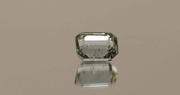 Light green octagon-shaped spodumene, 11.9 carat, 10.9 × 8.2 × 6.4 mm, no treatment, unknown origin.