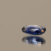 Blue sapphire crystal gemstone 1.42 carat oval cut, heat-treated, Madagascar origin, dimensions 8.66 × 5.43 × 2.85 mm, AIG certified.