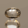 Light yellow oval-shaped spodumene, 9.65 carat, 13.6 × 10.7 × 8.6 mm, no treatment, unknown origin.