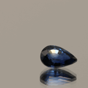 Royal blue pear-shaped sapphire, 0.86 carat, 7.17 × 4.82 × 3.20 mm, heat-treated, Madagascar origin, IGS certified.