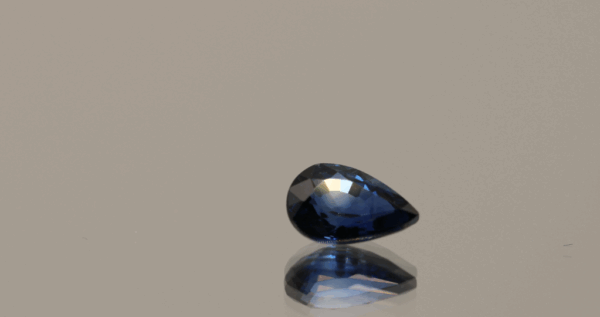 Royal blue pear-shaped sapphire, 0.86 carat, 7.17 × 4.82 × 3.20 mm, heat-treated, Madagascar origin, IGS certified.