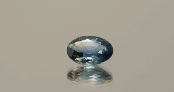 Blue sapphire oval, heat treated, unknown origin, 1.73 carat, dimensions 8.61 × 6.69 × 3.64 mm, AIG certified.