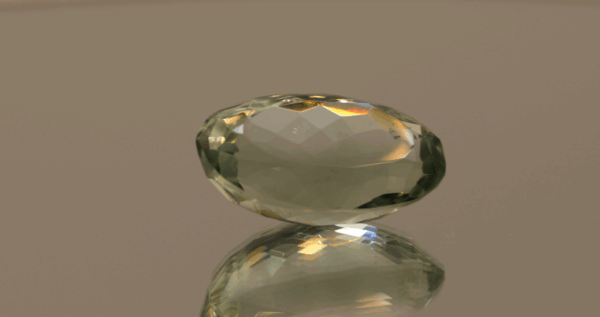 Natural prasiolite gemstone, 15.77 carat, oval cut, pale green color, untreated, loose gemstone, dimensions 20.9 × 12.1 × 9.5 mm, ideal for fine jewelry.